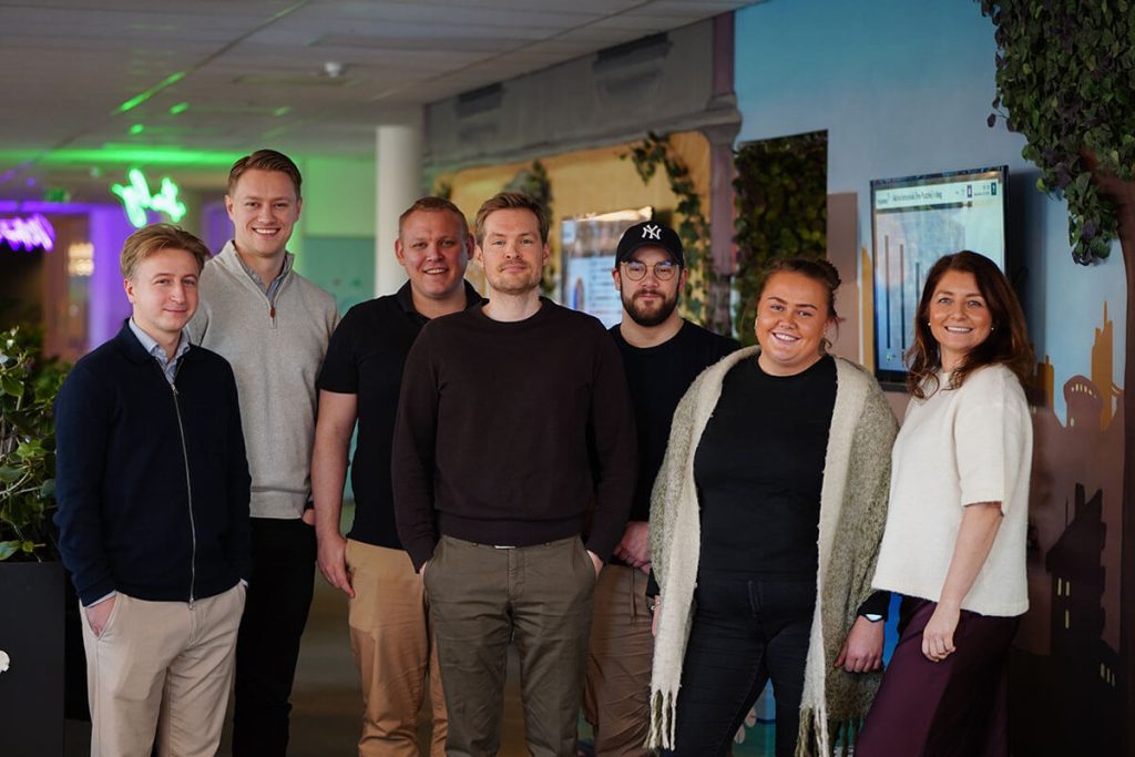 Gruppebilde av syv personer fra Tripletex sitt onboardings- og opplæringsteam.